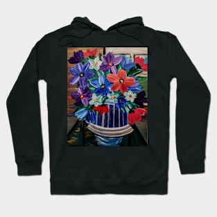 A beautiful bouquet flowers in a glass and gold vase . Hoodie